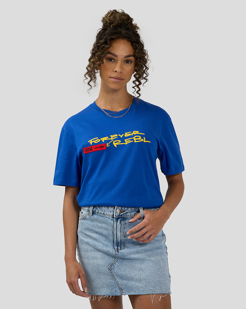 Front view of a female model wearing royal blue Oracle Red Bull Racing 20th Anniversary T shirt with bold yellow graphic.