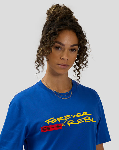 Close-up of a female model wearing royal blue Oracle Red Bull Racing 20th Anniversary T shirt with yellow graphic and red label.
