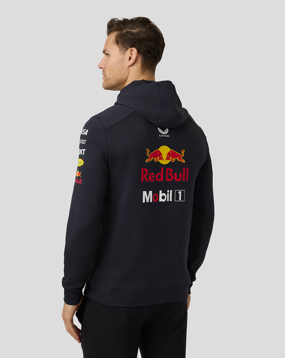 Back view of a man in navy night sky Red Bull Racing Teamline hoodie with a large logo on the back
