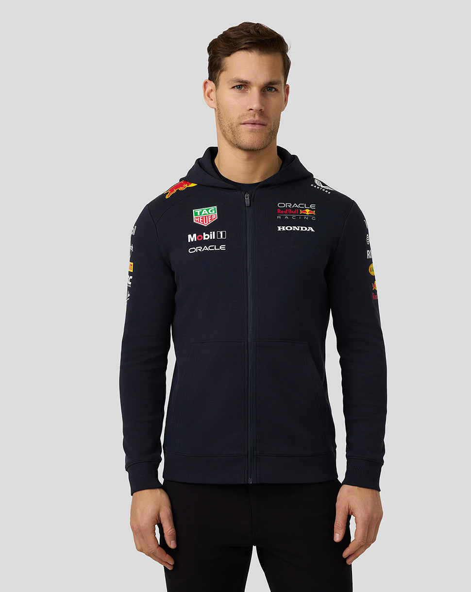 Male model in navy Oracle Red Bull Racing Teamline Full Zip Hoodie with hood and team graphics
