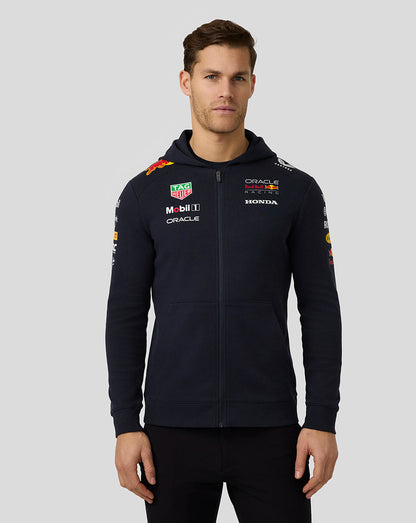 Male model in navy Oracle Red Bull Racing Teamline Full Zip Hoodie with hood and team graphics