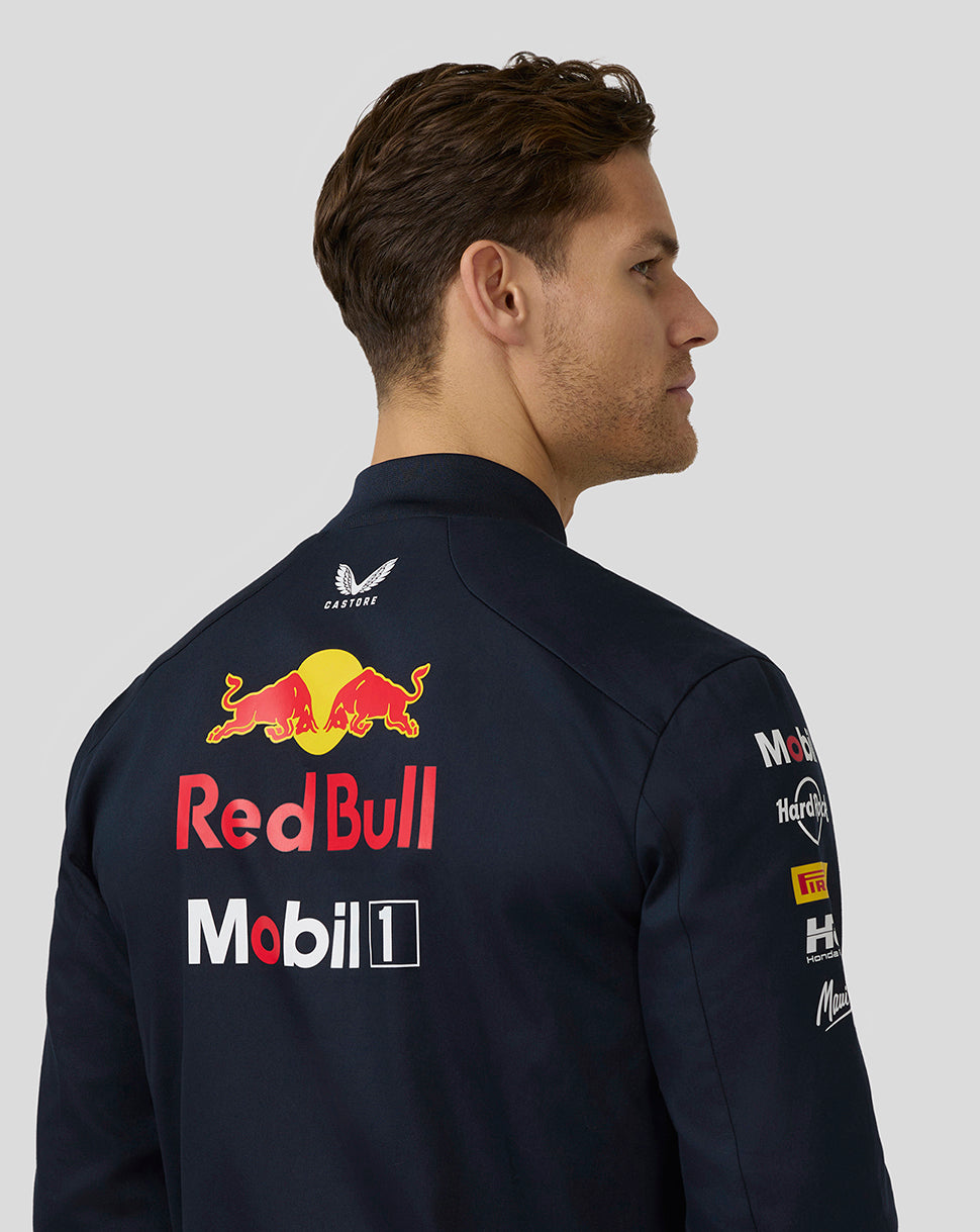 Back view of navy Red Bull racing bomber jacket with large Red Bull and Mobil 1 logos and patches on sleeve.