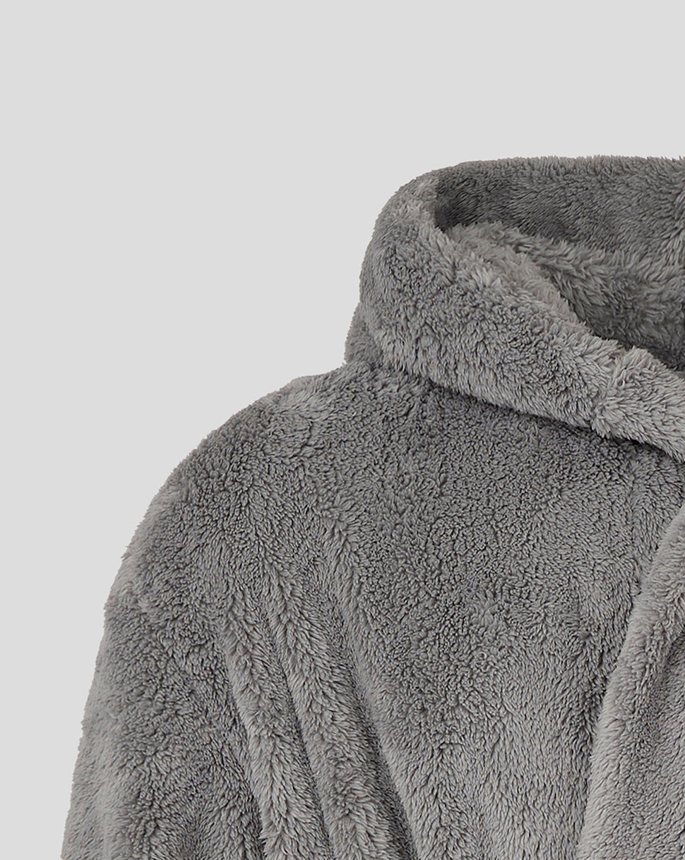 Close-up of grey plush dressing gown fabric with hood edge