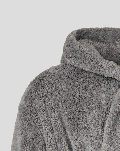 Close-up of grey plush dressing gown fabric with hood edge