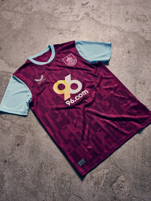 Burnley FC 24/25 women's home shirt in maroon with sky blue sleeves, featuring the club crest and 96.com sponsor.