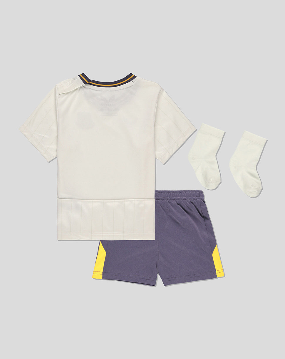 Back view of Everton 24/25 third nested baby kit with cream jersey, purple shorts, and white socks