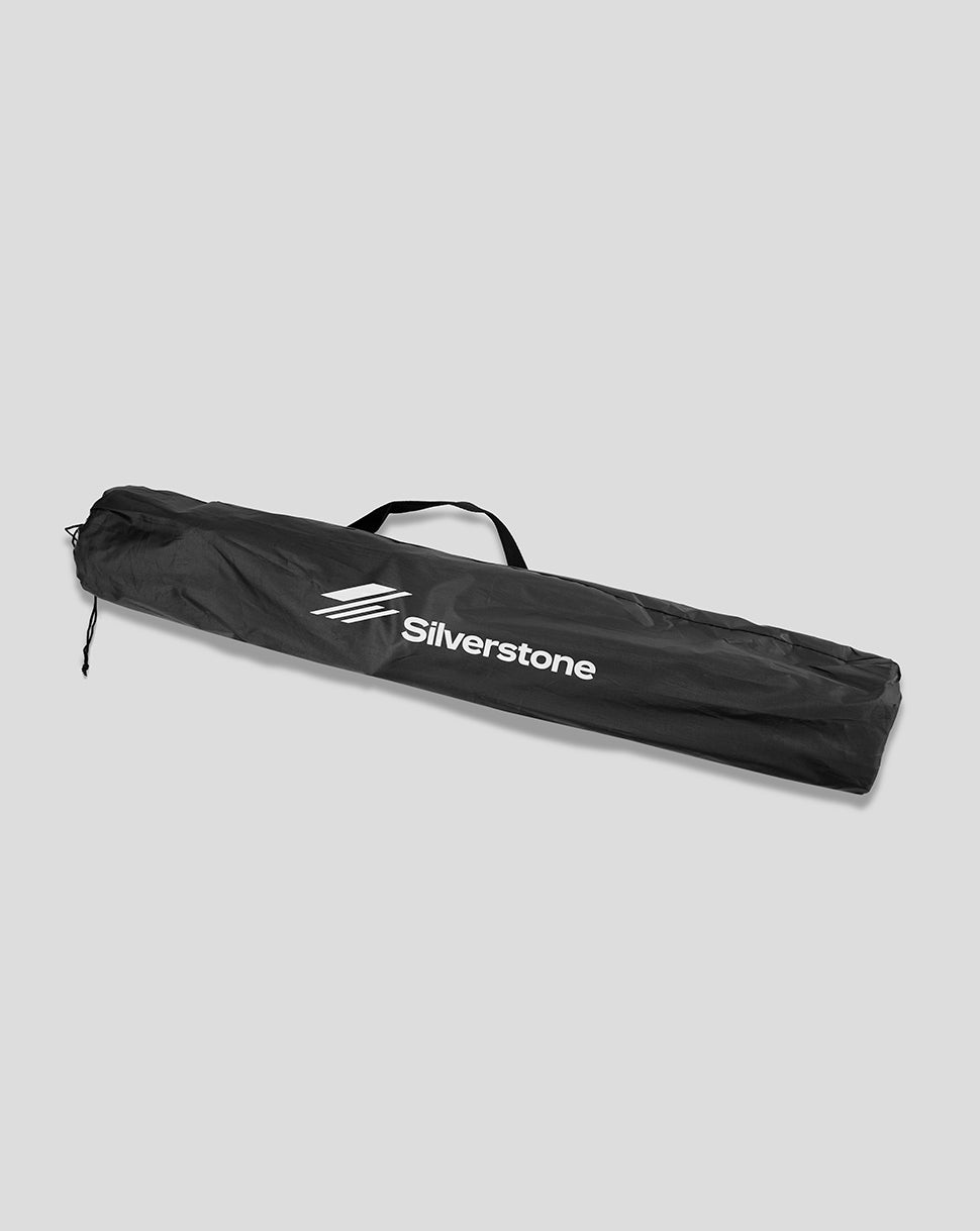Foldable Black Silverstone chair in its carrying bag with a white Silverstone logo
