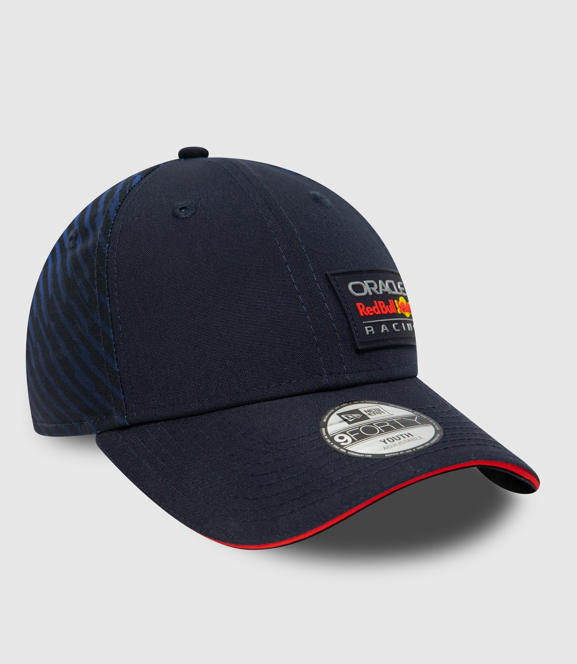 Back view of navy youth cap showing adjustable snap closure