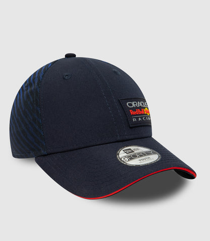 Back view of navy youth cap showing adjustable snap closure