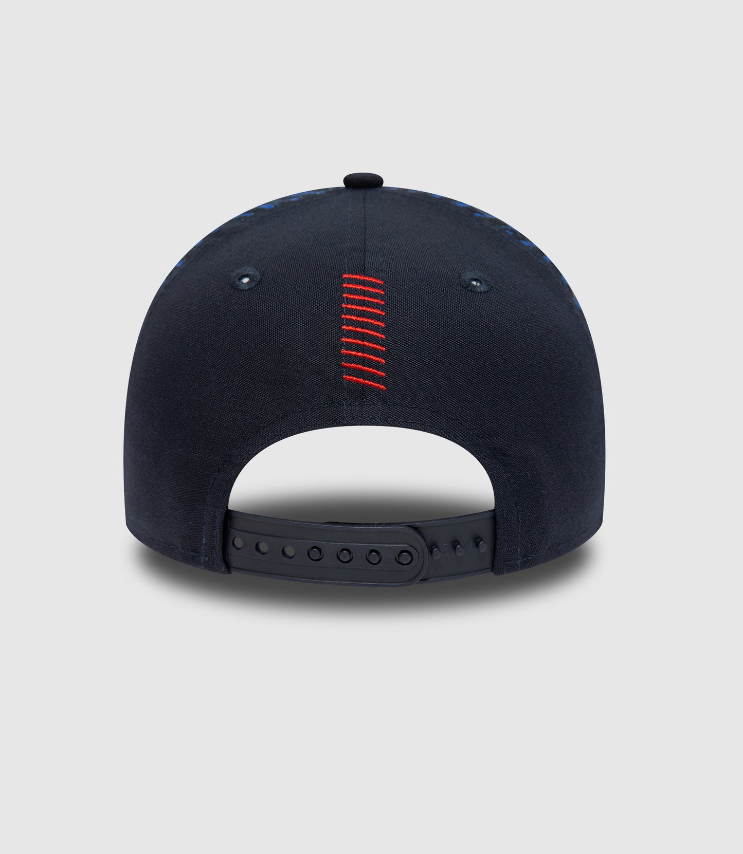 Back view of navy cap with red stitched center seam and adjustable strap