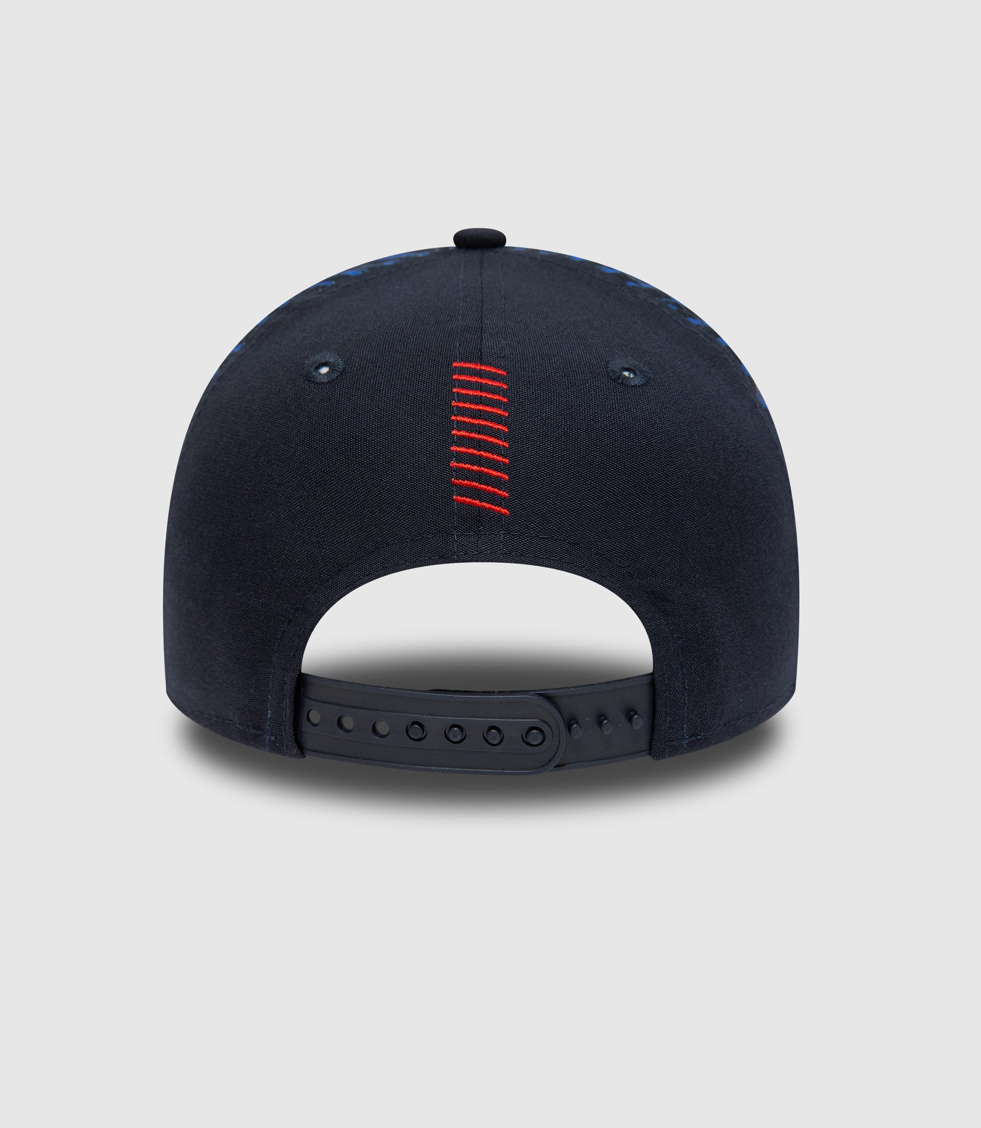 Back view of navy cap with red stitched center seam and adjustable strap