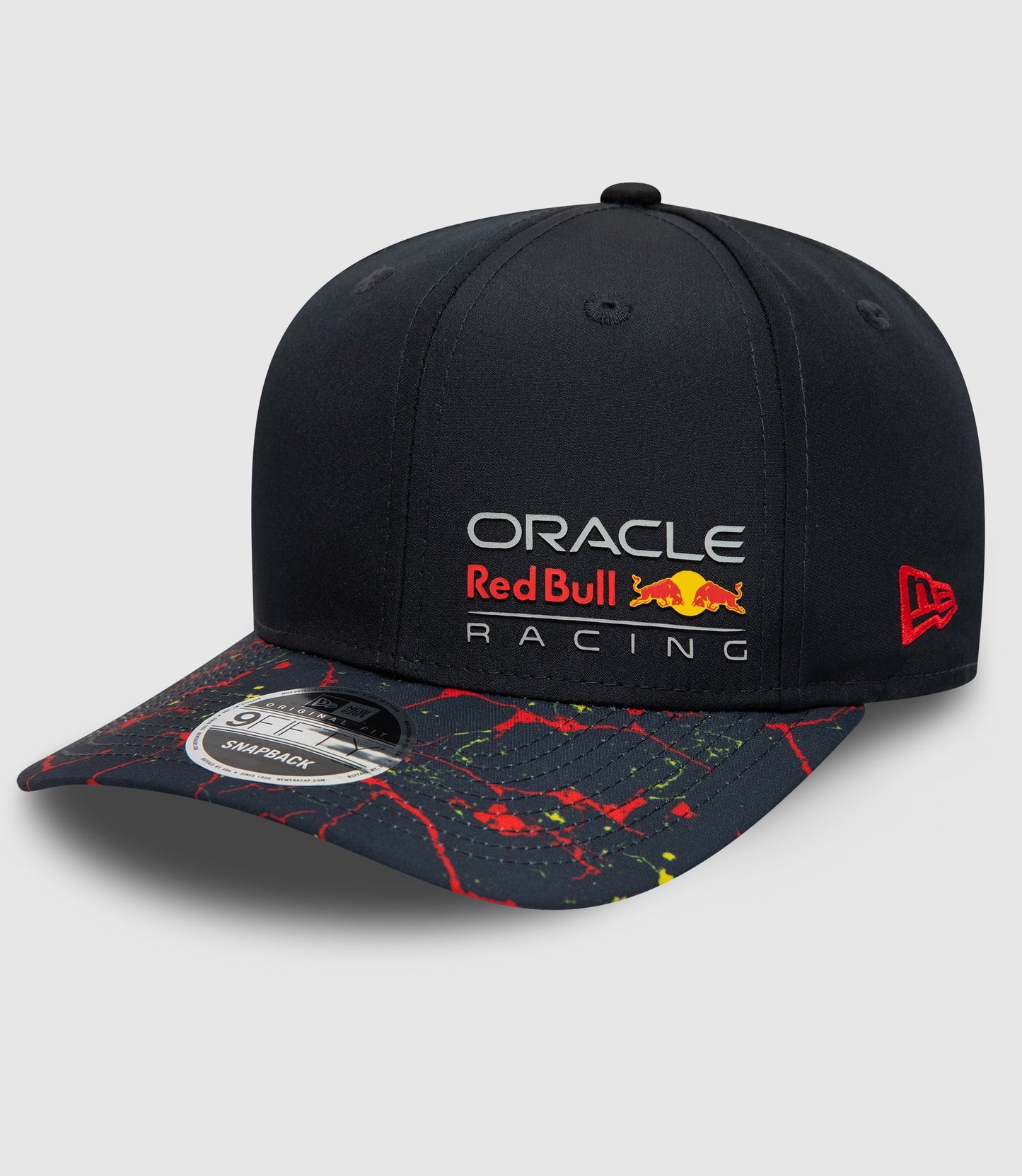 Close up of navy Oracle Red Bull Racing snapback cap showing front crown with logo and New Era emblem