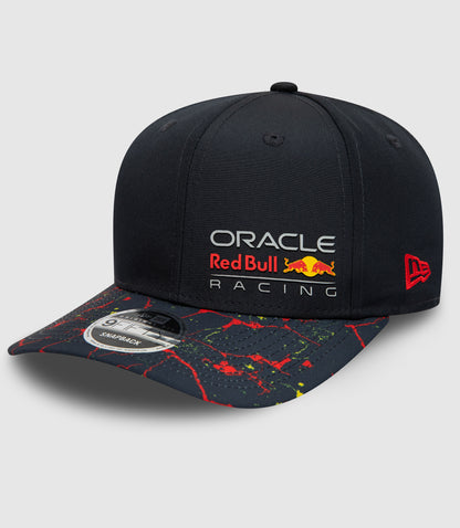 Close up of navy Oracle Red Bull Racing snapback cap showing front crown with logo and New Era emblem