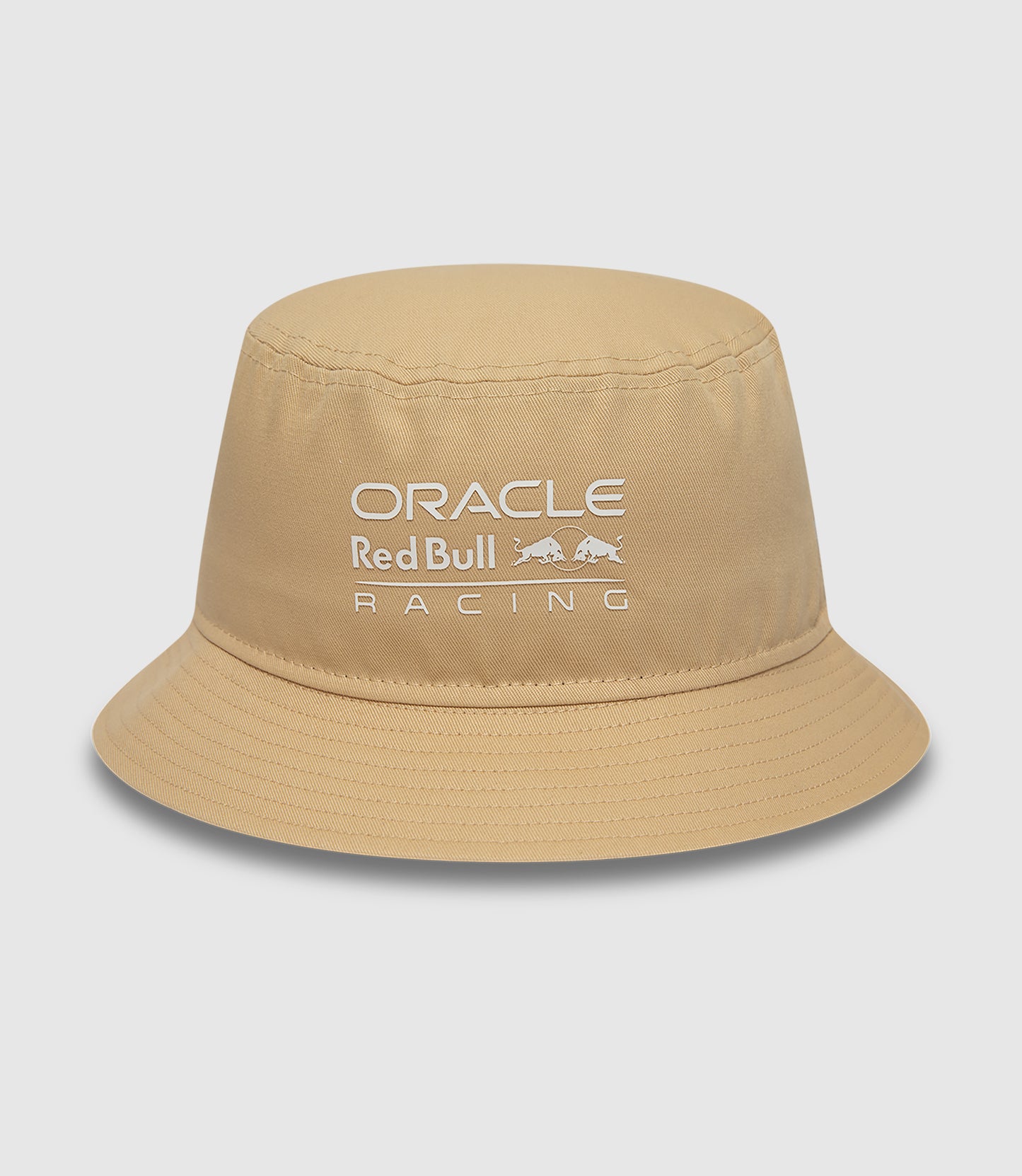 Sand colored bucket hat with Oracle Red Bull Racing logo on the front and New Era flag on the side
