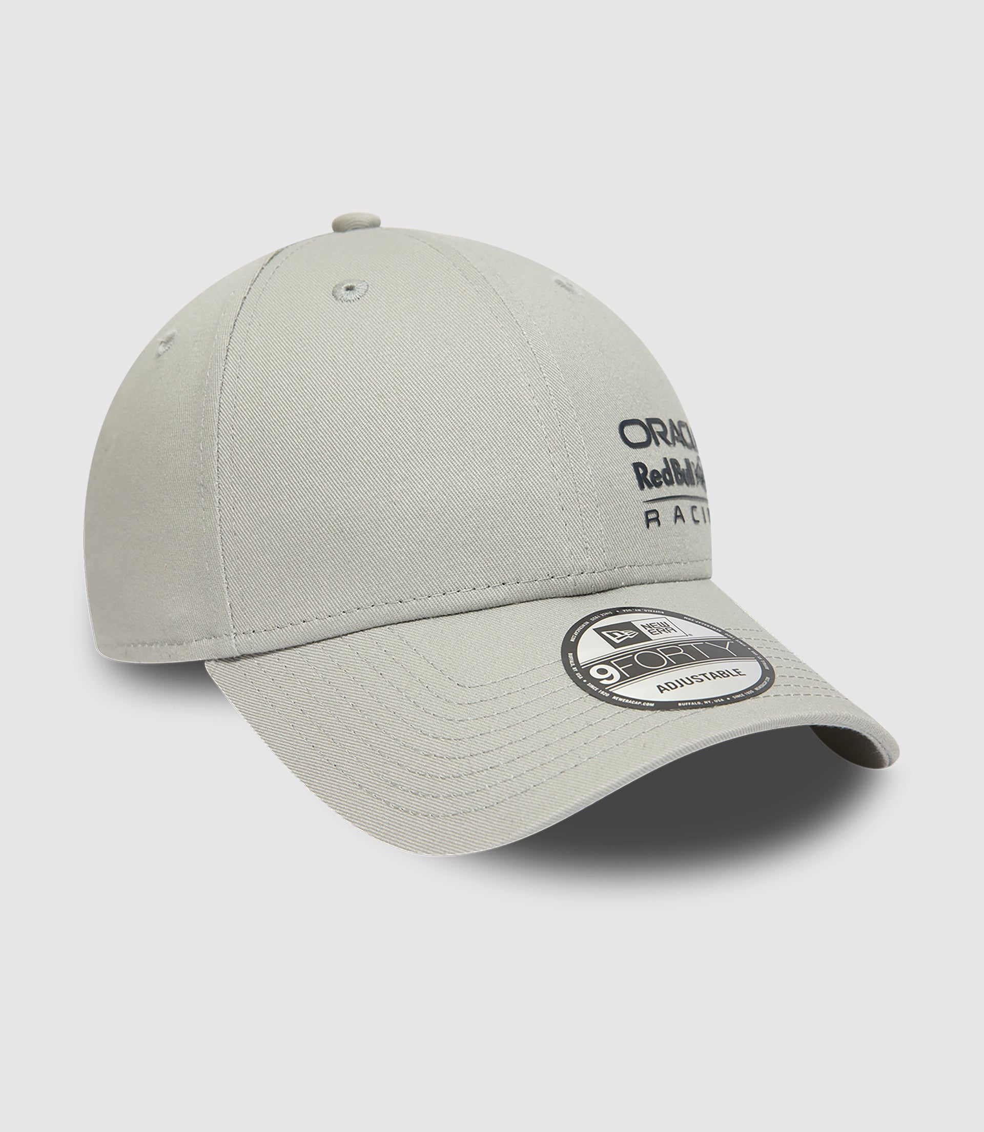 Close up of grey New Era 9FORTY cap crown with center button and stitched eyelets