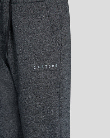 Close up of charcoal marl joggers fabric with Castore branding on the thigh.