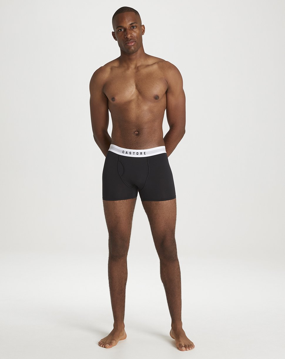 Male model wearing black Castore boxer shorts with white waistband