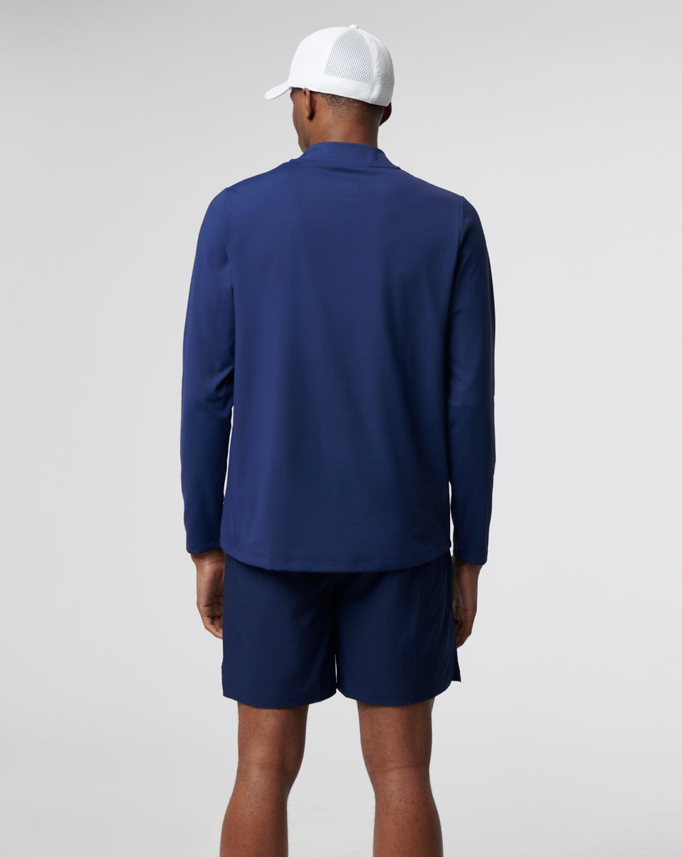 Back view of a person wearing navy Active Mid Layer 1/4 Zip top