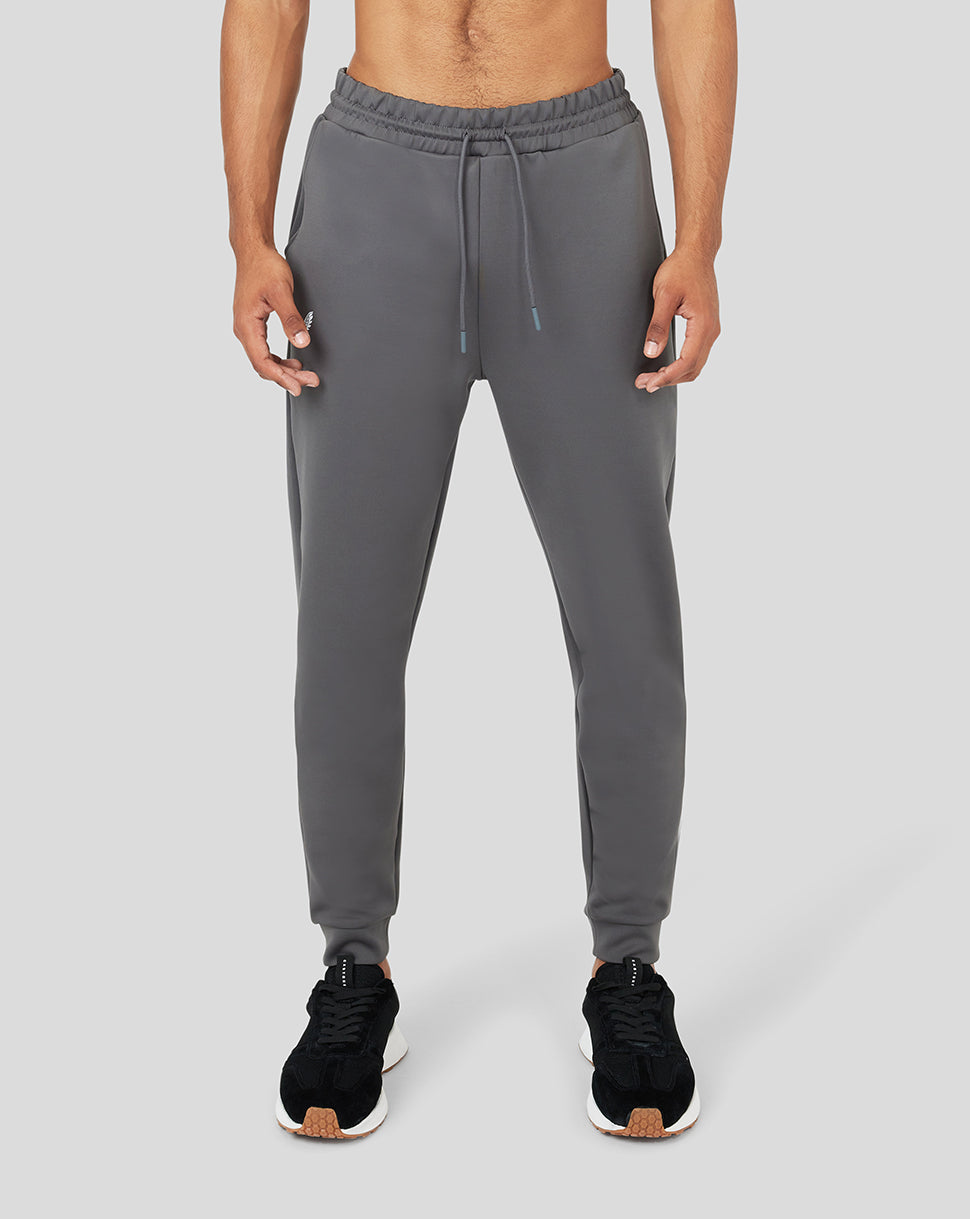 Front view of gray Ore Capsule scuba jogger worn by a model with a drawstring waist.