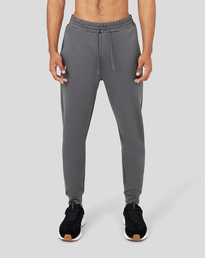 Front view of gray Ore Capsule scuba jogger worn by a model with a drawstring waist.