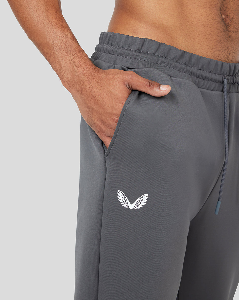 Close-up of the pocket and white wing logo on the gray Ore Capsule scuba jogger.