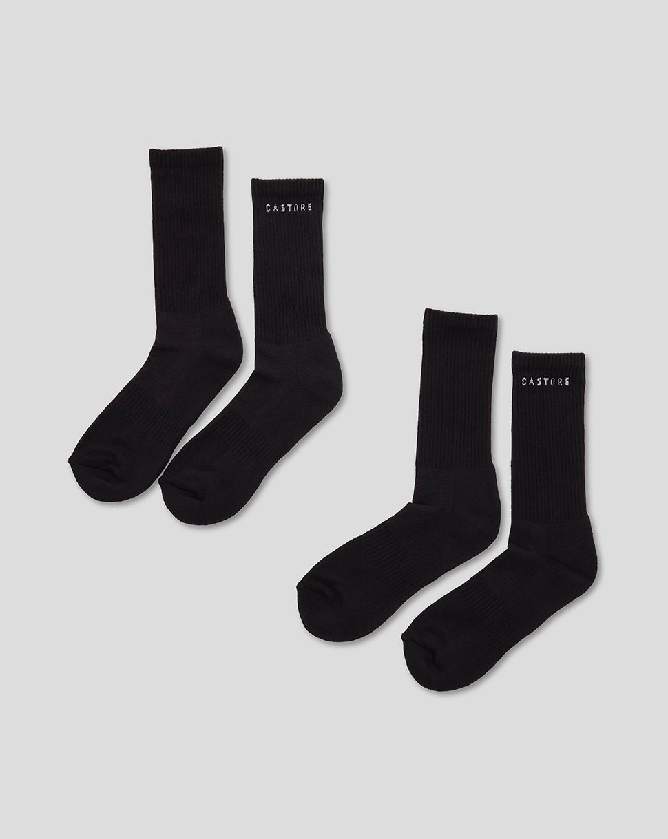 Two black Castore crew socks laid flat with ribbed cuffs for everyday wear.