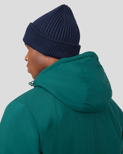 Profile view of navy ribbed Peacoat Active Beanie with a folded cuff.