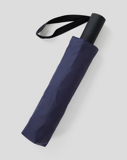 Oracle Red Bull Racing night sky short umbrella rolled with a black loop strap and matching sleeve