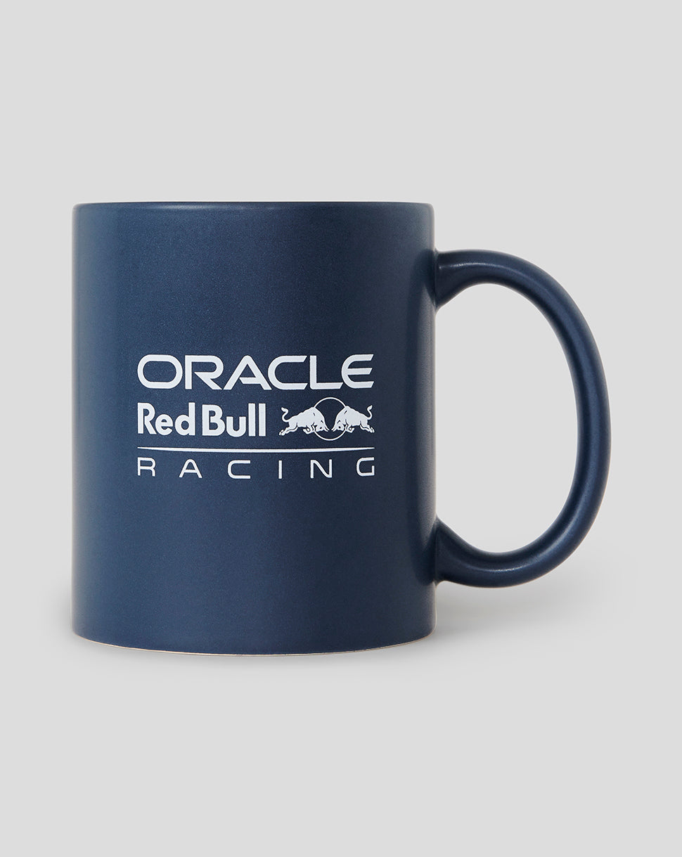 Side view of a night sky blue Oracle Red Bull Racing mug with white branding