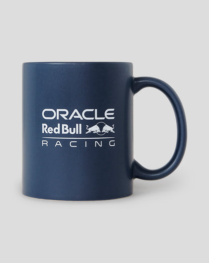 Side view of a night sky blue Oracle Red Bull Racing mug with white branding