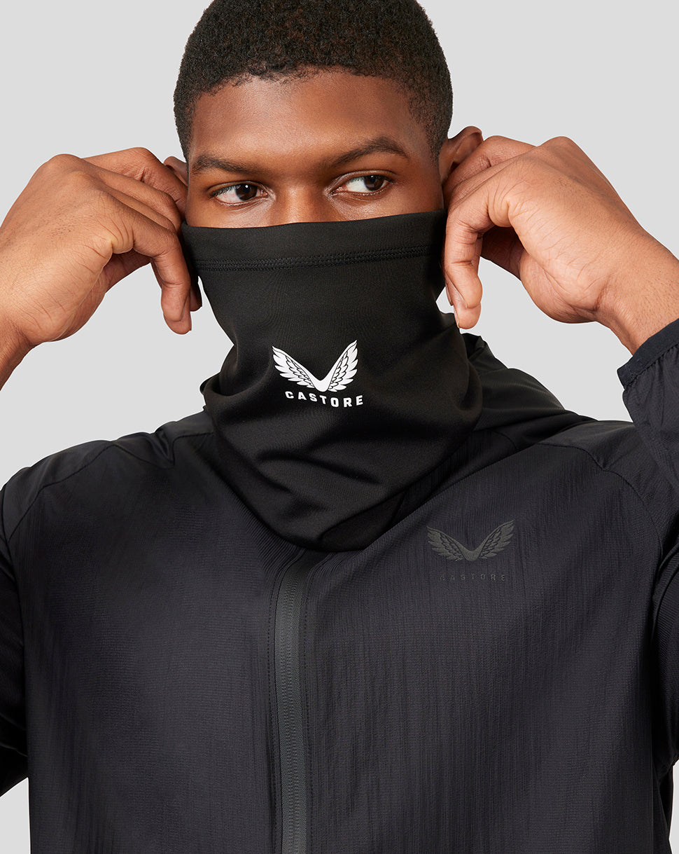 Front view of a male model with a black Castore snood pulled up over the lower face.