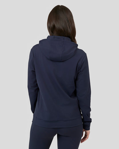Back view of navy Oracle Red Bull Racing women's overhead hoodie on a model with a relaxed fit and hood.