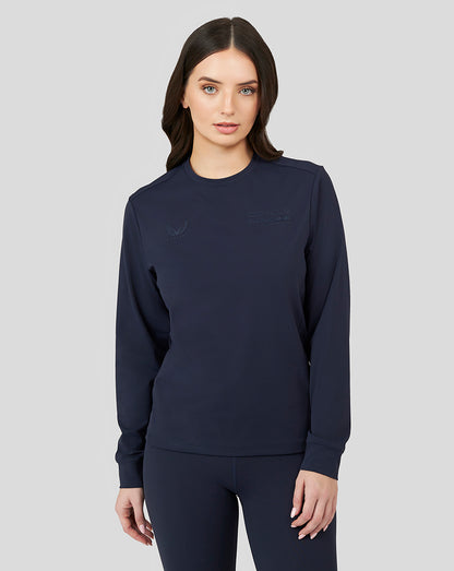 Woman modeling a navy Night Sky Oracle Red Bull Racing sweat top with subtle chest logos