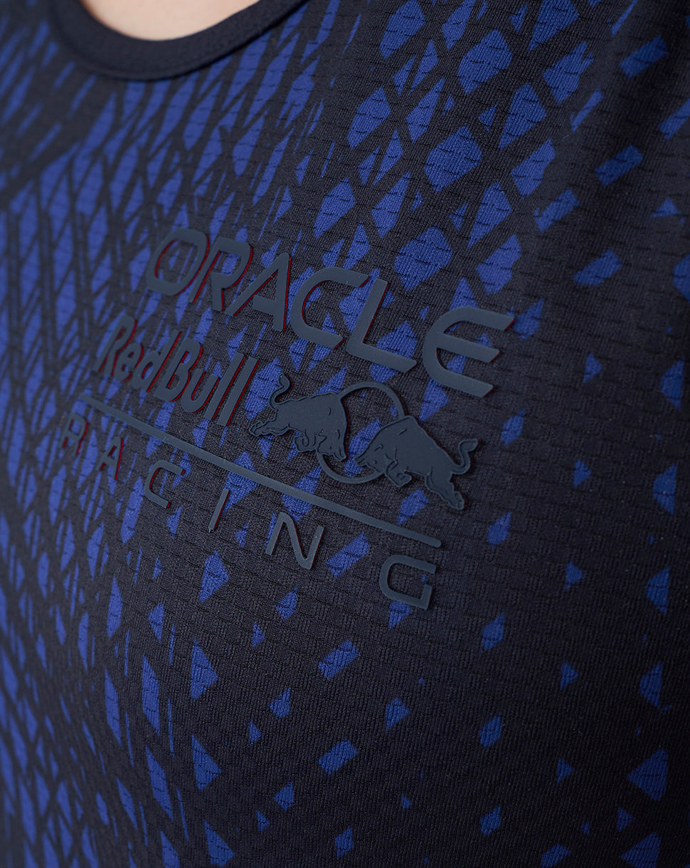 Close-up of front chest showing high-build heat transfer Oracle Red Bull Racing branding on the navy patterned tank top