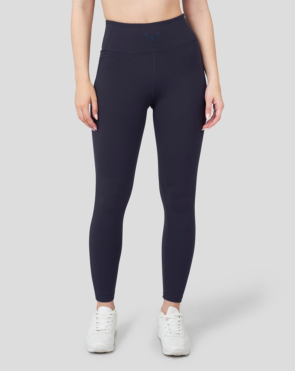 Front view of a model wearing Oracle Red Bull Racing Night Sky running leggings with side pockets.