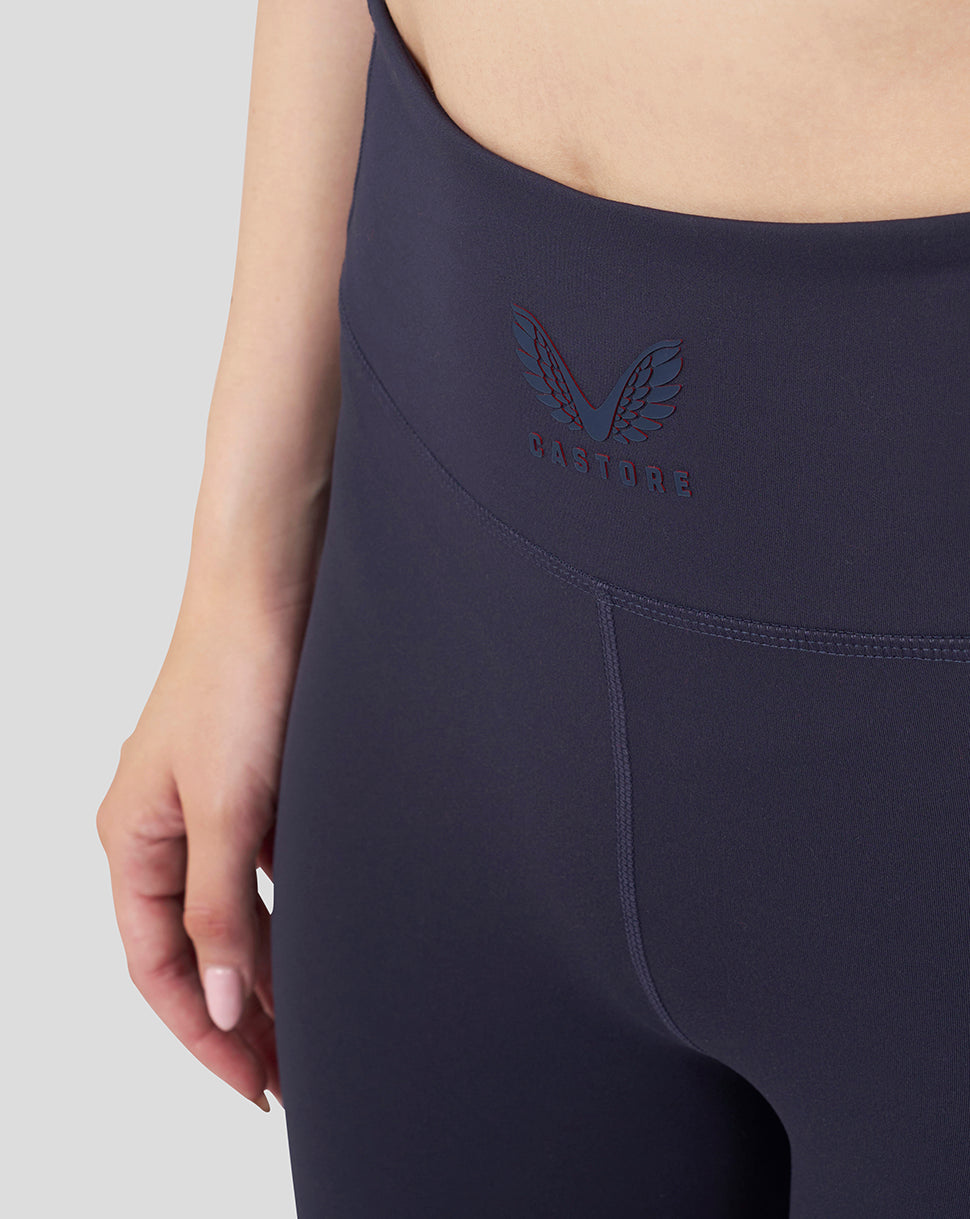 Close-up of navy high waist leggings waistband showing Castore logo