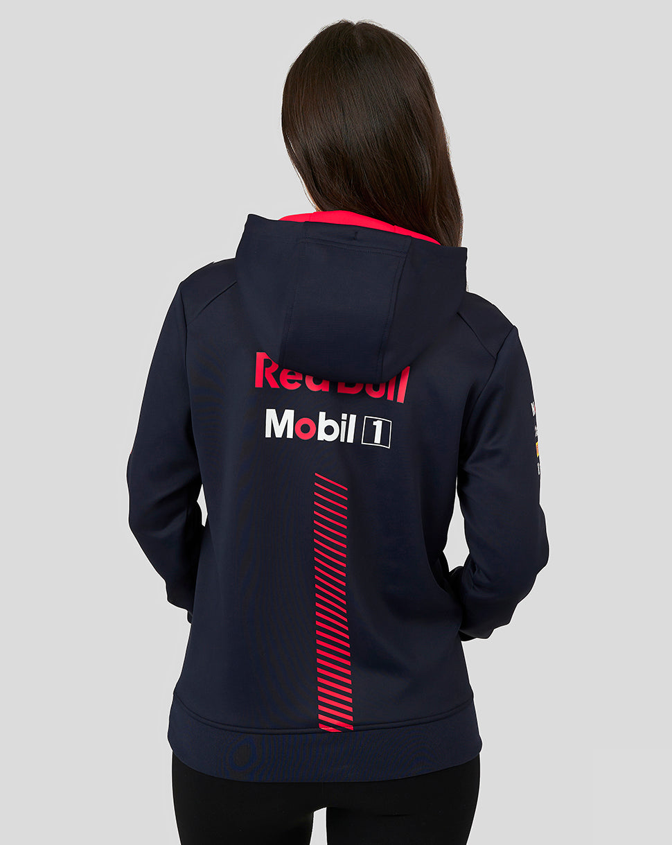 Back view of a woman wearing a Night Sky navy Oracle Red Bull Racing pullover hoodie with large sponsor logos on the back