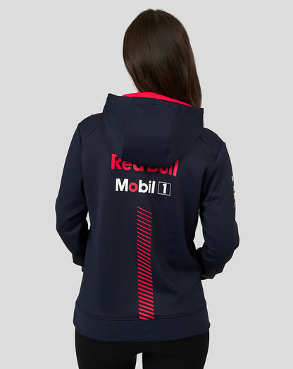 Back view of a woman wearing a Night Sky navy Oracle Red Bull Racing pullover hoodie with large sponsor logos on the back