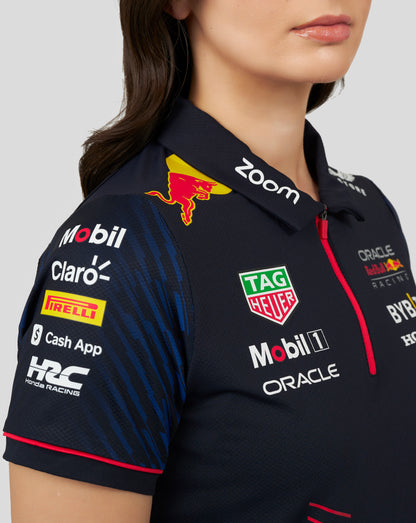 Close up of navy polo chest and shoulder with sponsor logos including TAG Heuer Mobil 1 and Oracle Red Bull Racing.