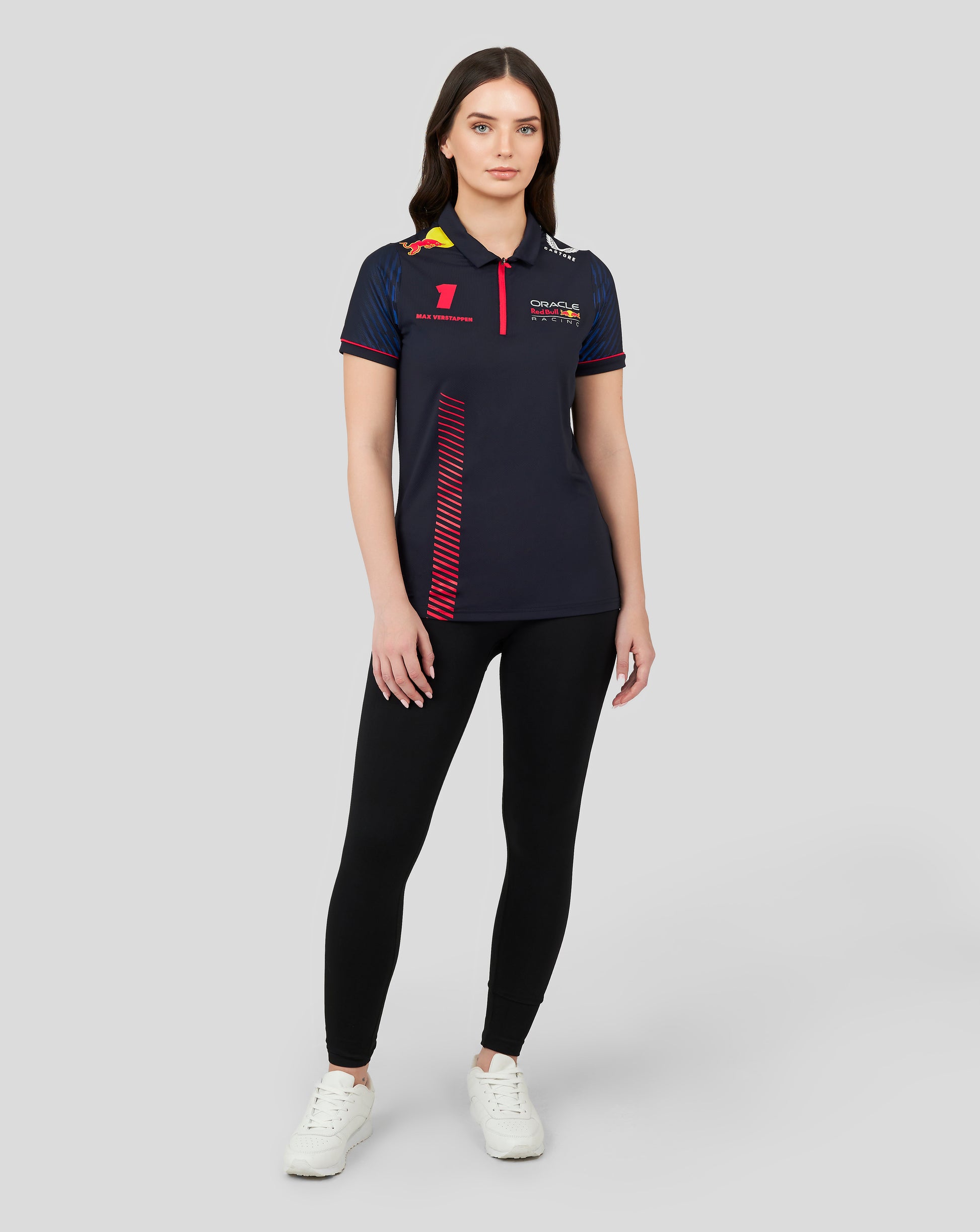 Model wearing navy Night Sky Oracle Red Bull Racing polo with red zipper, Verstappen number 1 and sponsor logos on chest