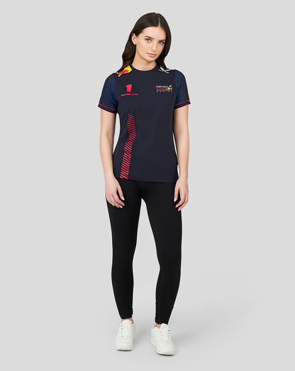 Full body shot of a woman wearing a navy Oracle Red Bull Racing T shirt with Max Verstappen number 1 and racing logos