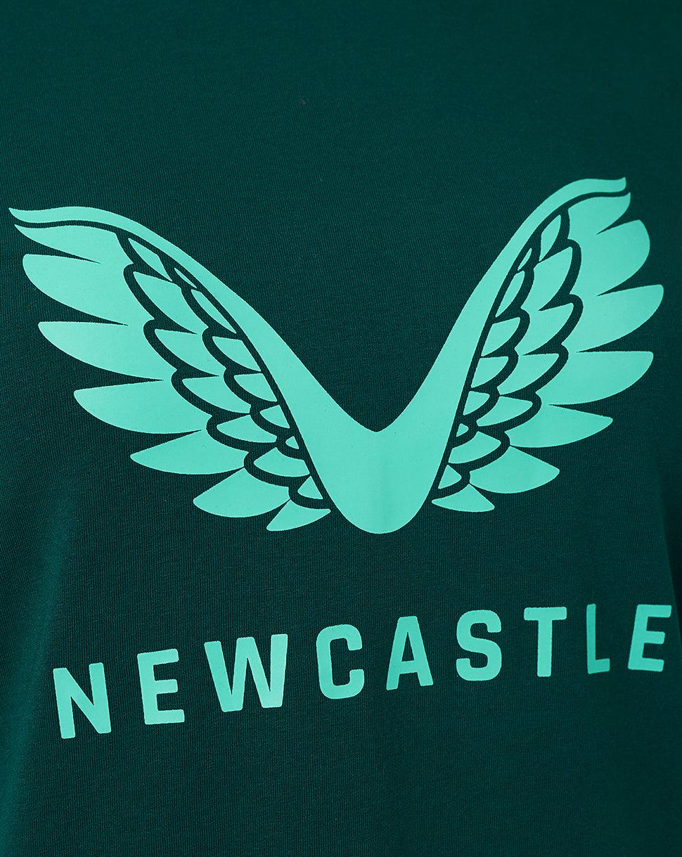Close-up of the teal wing emblem on the dark green Newcastle United Travel Logo T Shirt