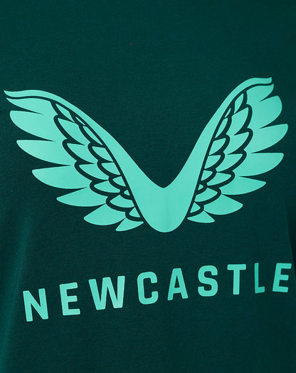 Close-up of the teal wing emblem on the dark green Newcastle United Travel Logo T Shirt