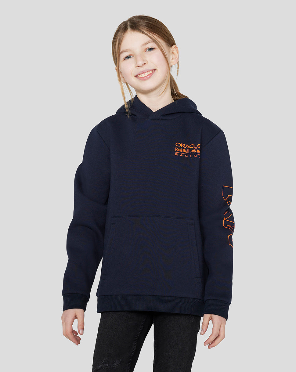 Child wearing a navy Night Sky Junior Oracle Red Bull Racing hoodie with orange chest logo and overhead hood