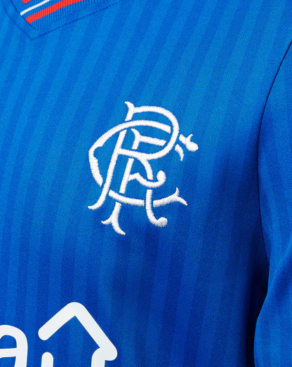 Close-up of blue Rangers Junior 23/24 home shirt showing white embroidered club crest on chest.