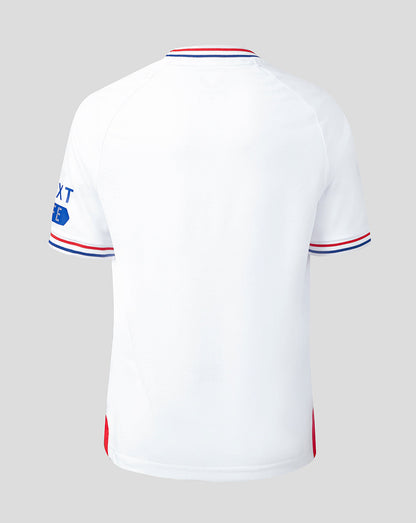 Back view of white Rangers junior away shirt with red and blue striped collar and cuffs