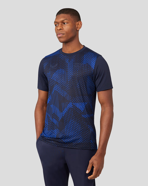 Male model wearing navy Night Sky Oracle Red Bull Racing running T shirt with blue abstract pattern and chest logo
