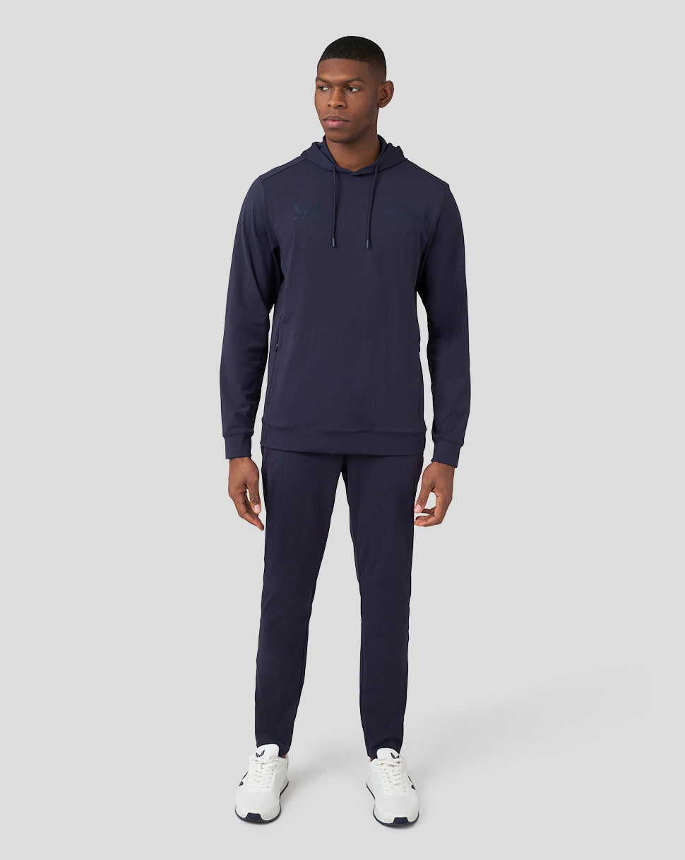 Full body shot of a model wearing the Oracle Red Bull Racing Performance overhead hoodie in Night Sky with matching joggers