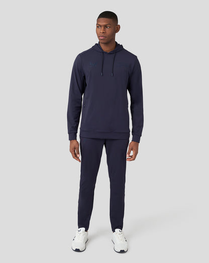 Full body shot of a model wearing the Oracle Red Bull Racing Performance overhead hoodie in Night Sky with matching joggers