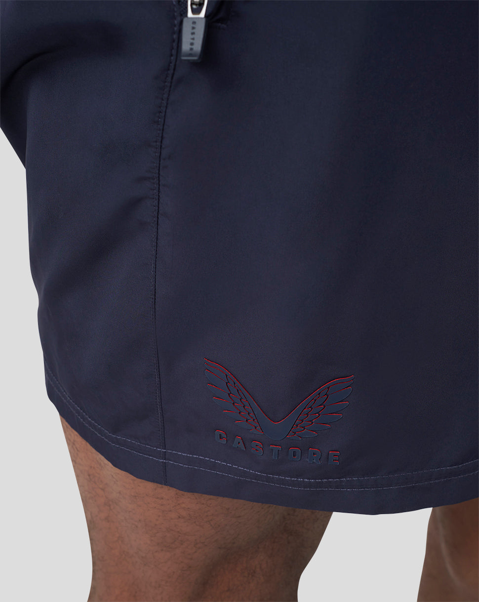 Close-up of navy Oracle Red Bull Racing running shorts with a zipper and Castore branding on the hem